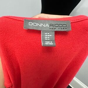 Red dress, dressed down or up, stretchy/thick fabric.